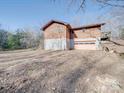 Back exterior of the cabin, revealing a two-story structure and garage at 3609 Shillinglaw Rd, Sharon, SC 29742