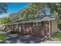 Side view of brick ranch house with driveway and landscaping at 401 Pine St, Fort Mill, SC 29715