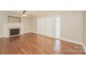 Spacious living room featuring hardwood floors and a fireplace at 401 Pine St, Fort Mill, SC 29715