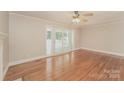 Bright living room with hardwood floors, fireplace, and sliding doors at 401 Pine St, Fort Mill, SC 29715