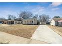 Cozy home with a long driveway and mature trees in a neighborhood setting at 505 Kings Mountain St, Clover, SC 29710