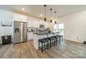 Modern kitchen with white cabinets, granite counters, and stainless steel appliances at 518 Switch St, York, SC 29745