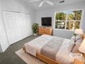 Virtually staged bedroom with large closet and window at 609 Mountainwater Dr, Charlotte, NC 28262