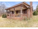 Brick ranch house with covered porch and large yard at 643 Alf Hoover Rd, Lincolnton, NC 28092