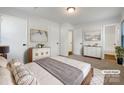 Bright and airy main bedroom with ample closet space and ensuite bath at 7015 Cardigan Ave, Charlotte, NC 28215