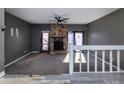 Spacious living room featuring a stone fireplace and a split level at 7912 Charter Oak Ln, Charlotte, NC 28226