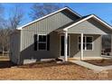 Gray house with black shutters and a front porch at 1027 Adams St, Statesville, NC 28677