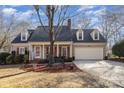 Charming one story home with covered front porch, front yard and attached garage at 11918 Parks Farm Ln, Charlotte, NC 28277