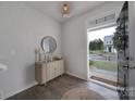 Bright entryway with wood-look floors, console table, and mirror at 215 Briana Marie Way, Indian Trail, NC 28079