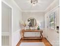 Entryway with hardwood floors, console table, and mirror at 2410 Hopecrest Dr, Charlotte, NC 28210