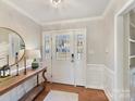 Bright entryway with hardwood floors and a wooden console table at 2410 Hopecrest Dr, Charlotte, NC 28210