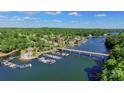 Stunning aerial view of waterfront community, boat docks, and bridge on a sunny day at 296 Windemere Isle Rd, Statesville, NC 28677