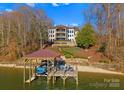 Beautiful lakefront home with landscaped yard and a private boathouse, perfect for enjoying waterfront living at 296 Windemere Isle Rd, Statesville, NC 28677