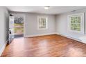 Bright living room featuring hardwood floors and two windows offering great natural light at 3138 Morson St, Charlotte, NC 28208