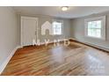 Bright living room with hardwood floors and lots of natural light at 3138 Morson St, Charlotte, NC 28208