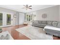Cozy living room featuring hardwood floors, neutral decor, and ample natural light at 3300 Chancellor Ln, Monroe, NC 28110