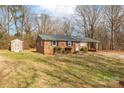 Brick ranch house with carport and storage shed at 3301 10Th Ne Ave, Conover, NC 28613