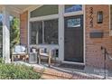 Inviting front porch with comfortable seating and a stylish entryway at 3723 Annlin Ave, Charlotte, NC 28209