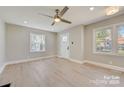 Spacious living room featuring hardwood floors and lots of natural light at 3920 Admiral Ave, Charlotte, NC 28205