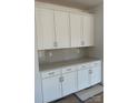 Close up on the kitchen cabinets, countertop, and backsplash at 4122 Eastover Glen Rd # 0316, Charlotte, NC 28269
