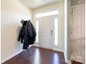 Bright entryway with hardwood floors and coat rack at 7562 Silver Arrow Dr, Charlotte, NC 28273