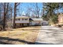 Two-story house with a long driveway and mature trees at 7716 Elwood Dr, Charlotte, NC 28227