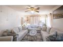 Spacious living room featuring a sectional sofa and large TV at 7716 Elwood Dr, Charlotte, NC 28227