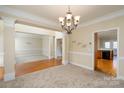 Formal dining room with hardwood floors and chandelier at 8809 Landsdowne Ave, Harrisburg, NC 28075