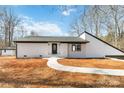 Charming white brick ranch home with a landscaped yard at 108 Vance Allen Ave, Rockwell, NC 28138