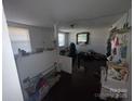 Living room with dark floors and a half-wall at 114 E Maine Ave, Bessemer City, NC 28016