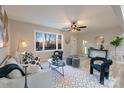 Inviting living room boasting a large window, ceiling fan, and stylish decor at 3004 Briarwood Ln, Gastonia, NC 28056