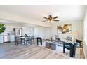 Modern living room featuring sleek hardwood floors, contemporary furnishings, and stainless steel appliances at 3004 Briarwood Ln, Gastonia, NC 28056