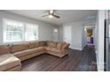 Living room with L-shaped sofa and hardwood floors at 3721 Braden Dr, Charlotte, NC 28216