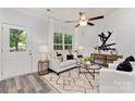 Bright living room with contemporary furnishings, large window and stylish decor at 404 Killian Ave, Mount Holly, NC 28120