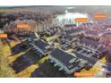Aerial view of a residential community with lake access, featuring boat docks, kayak dock, picnic areas and a fire pit at 4194 La Crema Dr, Charlotte, NC 28214