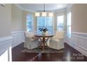Inviting breakfast nook featuring a round table with four chairs and abundant natural light from the bay windows at 4194 La Crema Dr, Charlotte, NC 28214