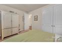 Neutral bedroom featuring a large wardrobe, carpeted floors, and doorways leading to other rooms at 4929 Norman Park Pl, Clover, SC 29710