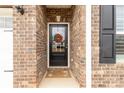 Close-up of the front door with decorative wreath and welcome mat at 515 Stickley Pl, Lancaster, SC 29720