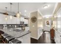 Open kitchen with a granite island, white cabinets and stainless steel appliances at 515 Stickley Pl, Lancaster, SC 29720