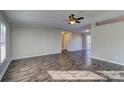 Spacious living room with gray walls and wood-look floors at 6415 Sherwood Ln, Denver, NC 28037