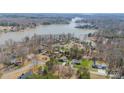 Picturesque aerial view of waterfront homes near a lake with private docks surrounded by mature trees at 6835 Ingleside Dr, Sherrills Ford, NC 28673