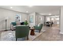 Open concept living and dining area with a view into the kitchen at 806 S Martin Luther King Ave, Salisbury, NC 28144