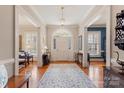 Elegant foyer with a large rug, hardwood floors, and an arched doorway at 1335 E Marion St, Shelby, NC 28150