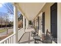Relaxing front porch featuring rocking chairs and classic architectural details with white railing at 1335 E Marion St, Shelby, NC 28150