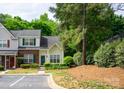 Inviting townhome with well-maintained landscaping, a neatly paved parking area, and a harmonious exterior color scheme at 1748 Pergola Pl, Charlotte, NC 28213