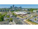 Cityscape view of Charlotte with commercial building in the foreground at 232 Parkwood Ave, Charlotte, NC 28206