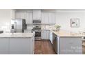 Modern kitchen featuring stainless steel appliances and granite countertops at 232 Parkwood Ave, Charlotte, NC 28206