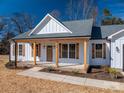 Front view of a white farmhouse with a covered porch and wooden posts at 2608 Maiden Salem Rd, Maiden, NC 28650