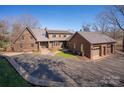 Beautiful brick home with lush landscaping and a circular driveway at 2700 River Ridge Pl, Fort Mill, SC 29708