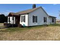 Home with a covered porch, showcasing the well-maintained exterior and large yard at 3186 Catawba St, Claremont, NC 28610